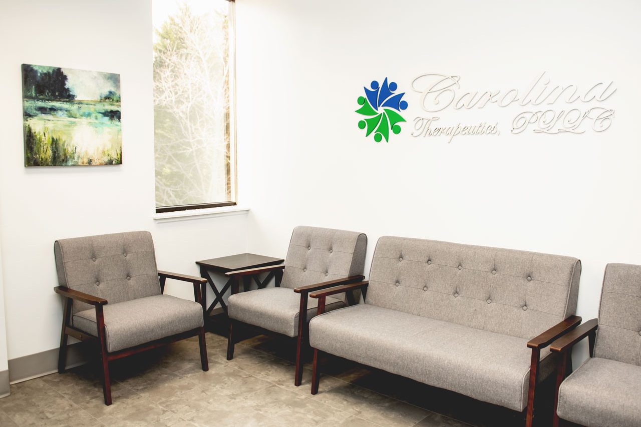 Carolina Therapeutics Fort Mill, SC office waiting room with soft grey chairs